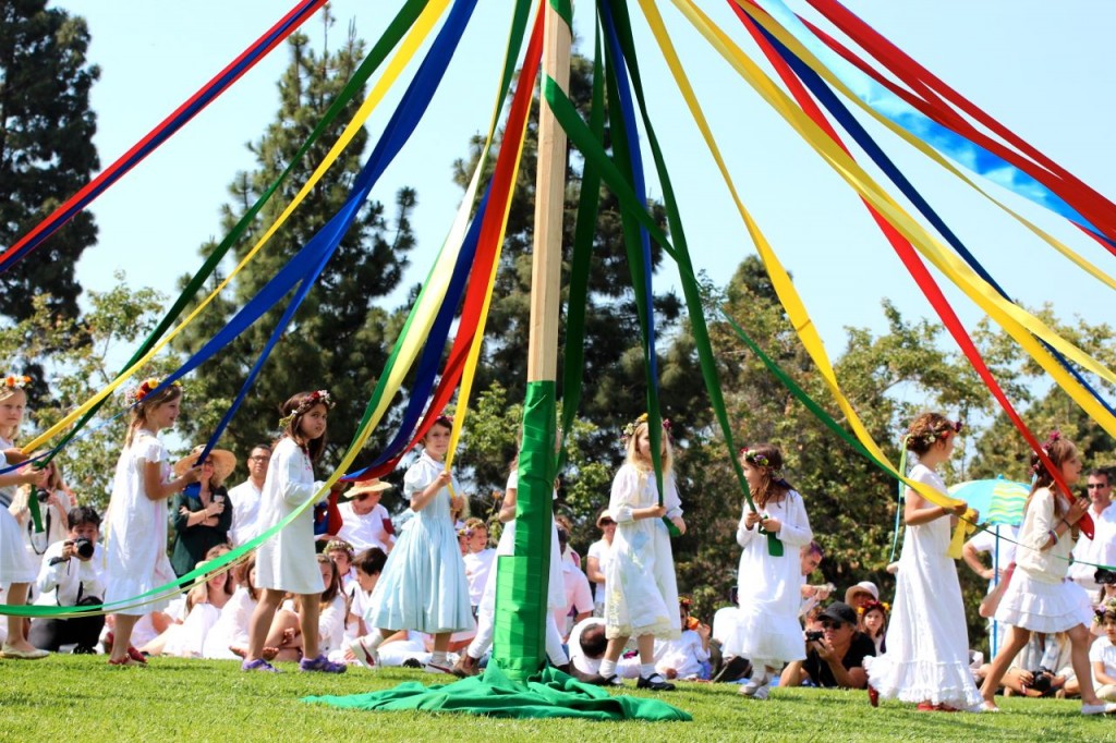 may faire. spring celebration, pole dancing